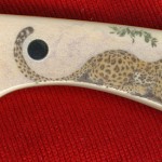 Closeup of Leopard Color Scrimshaw on Ivory Hunter Closeup of Leopard Color Scrimshaw on Ivory Hunter (click to enlarge)